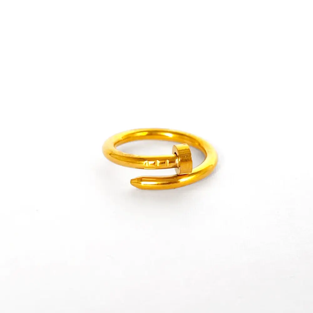 *ANILLO EN ACERO GOLD CLAVO CARTIER