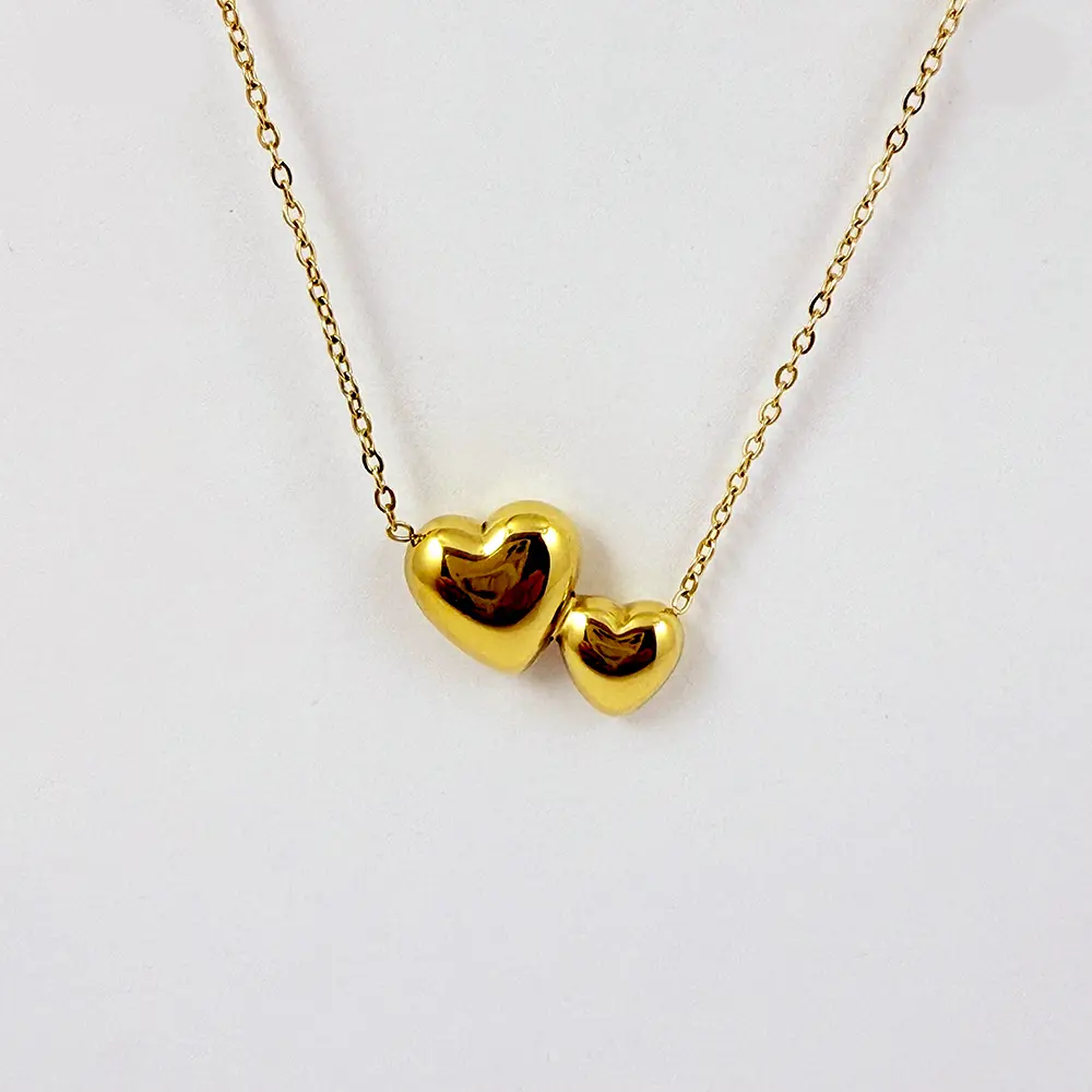 Collar en acero gold dijes corazones dobles