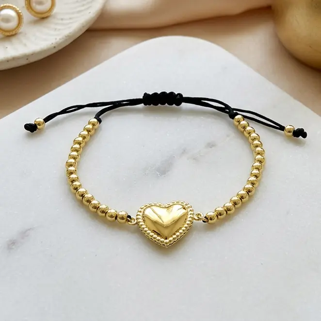 Pulsera en acero gold cordón ajustable balines dije corazón