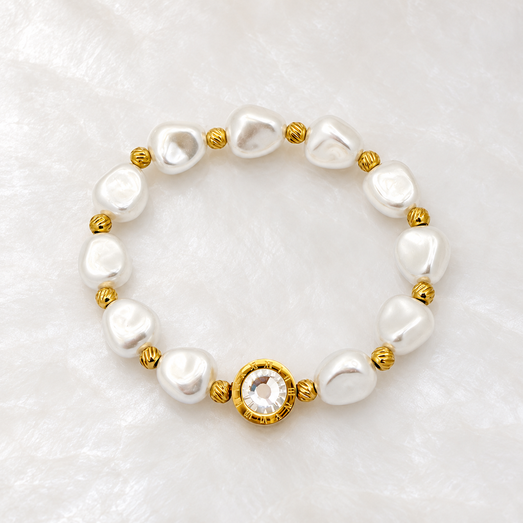 Brazalete en acero gold elastico perla circón