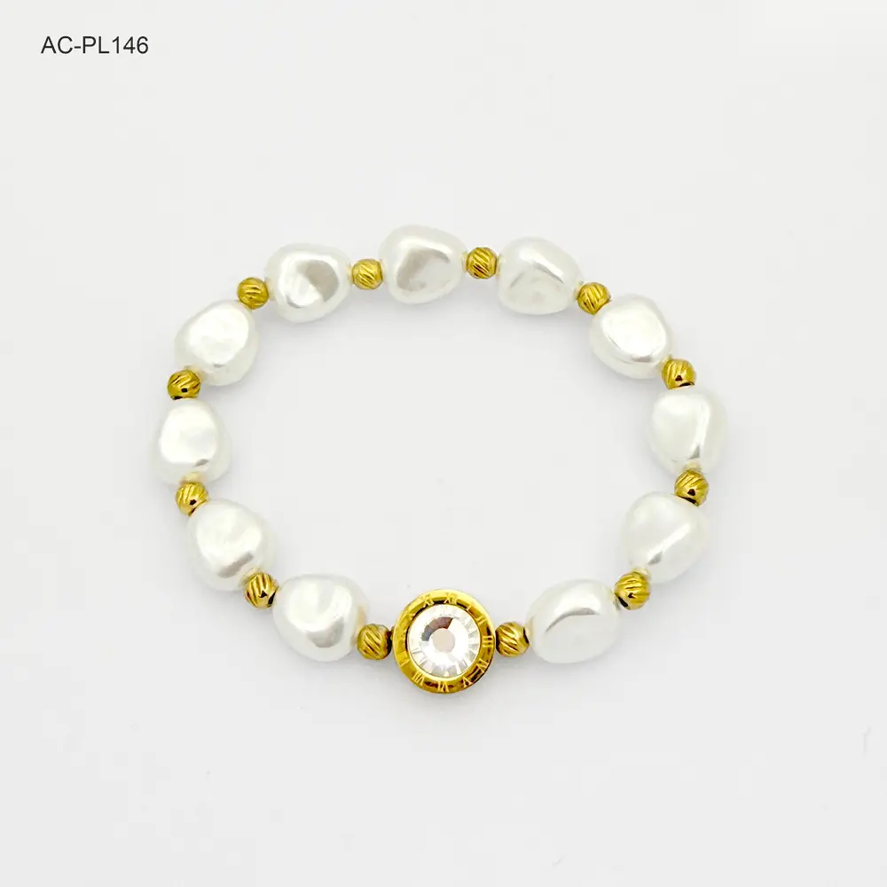 Brazalete en acero gold elastico perla circón