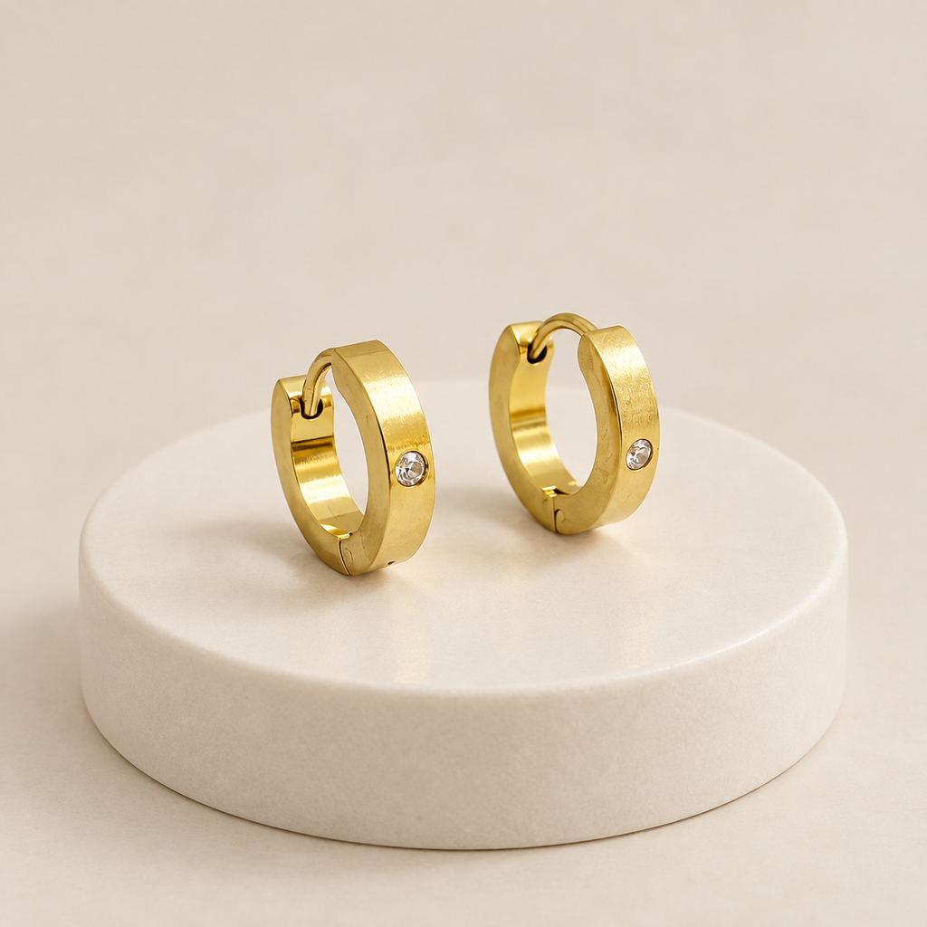 Argolla gold huggie lisa circon 1,3cm acero