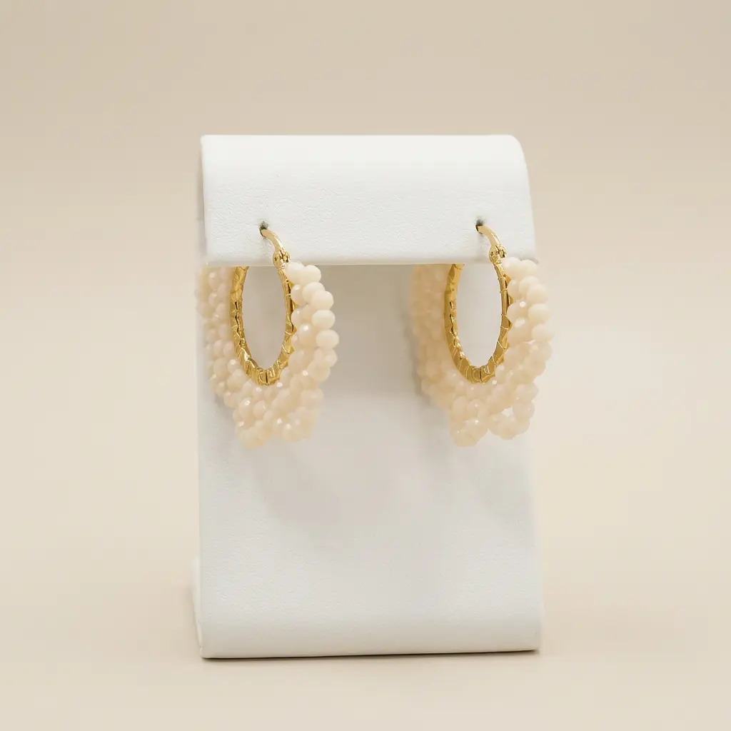 Argolla en acero gold con perlas tejidas 