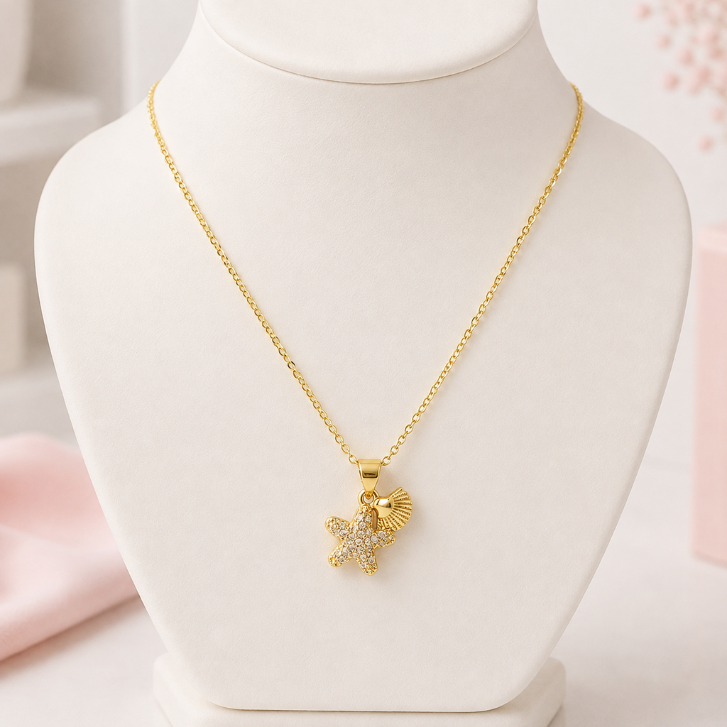Collar en rodinado gold dije estrellita de mar conchita