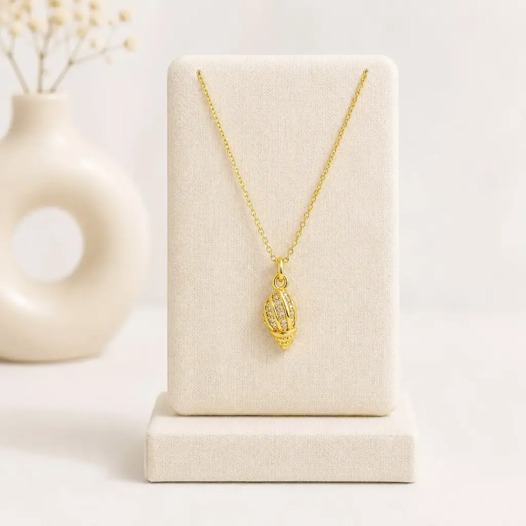 Collar en rodinado gold dije caracol