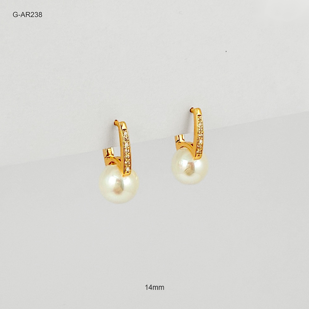 Arete especial broche catalan rodinado gold linea microcircones blancos perla swarovsky