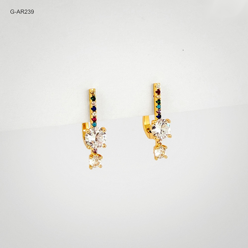 Arete especial broche catalan rodinado gold microcircones de color cristal blanco