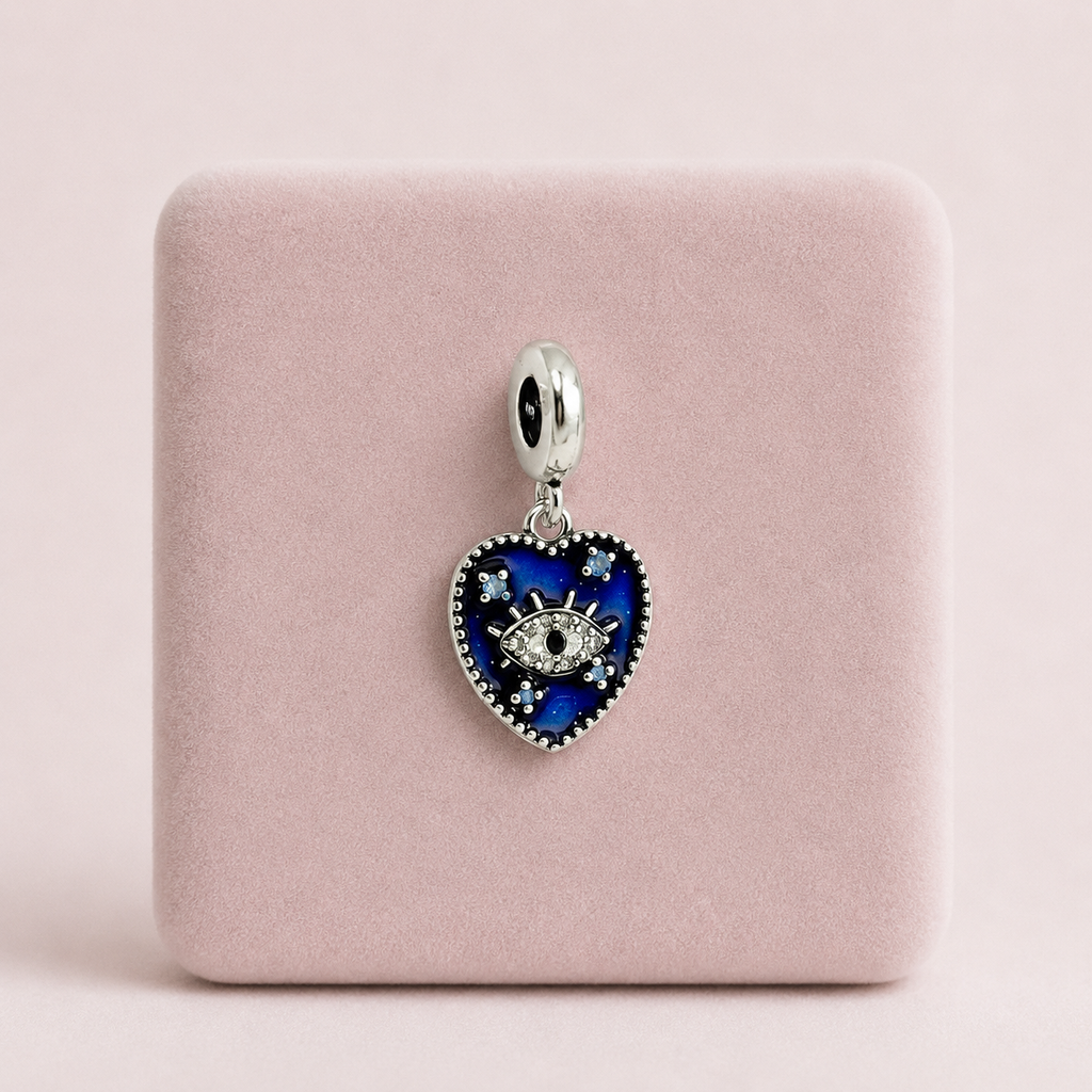 Dije en plata ley 925 corazón ojito