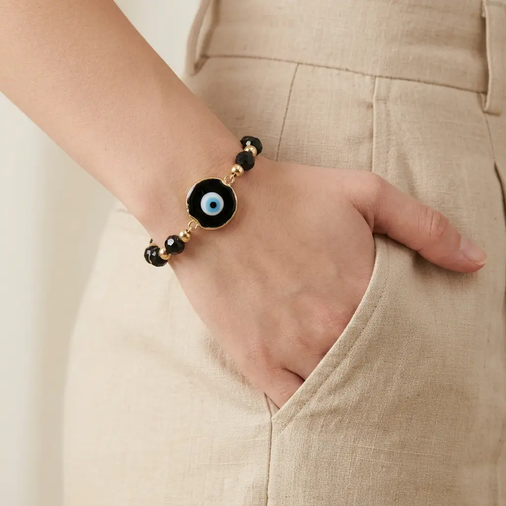 Pulsera Artesanal dije ojito recina piedra negra 