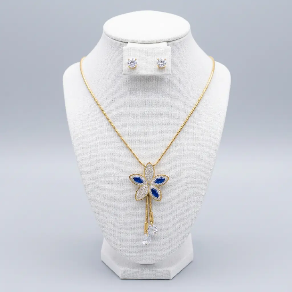 Juego en acero gold collar de flor con circones azul y blanco