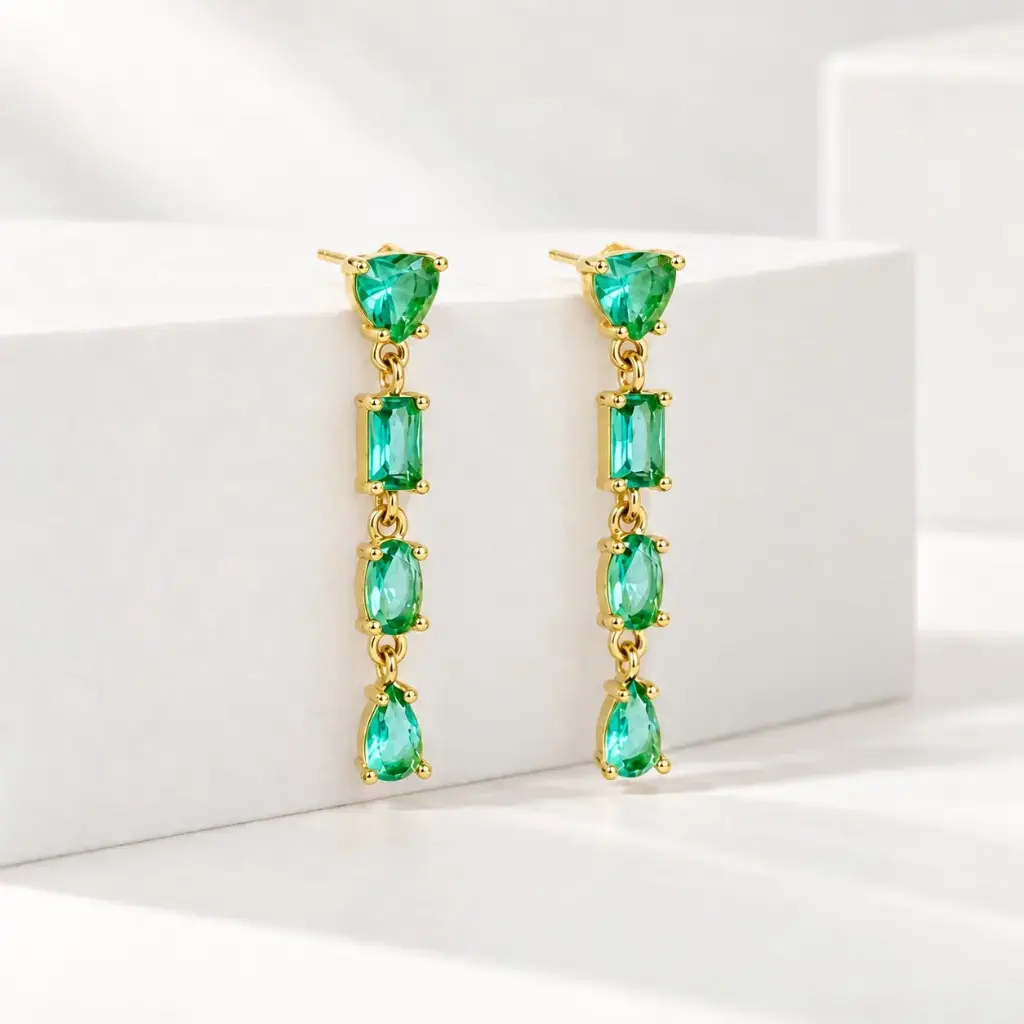 Aretes en rodinado gold largos cristales geométricos turquesa
