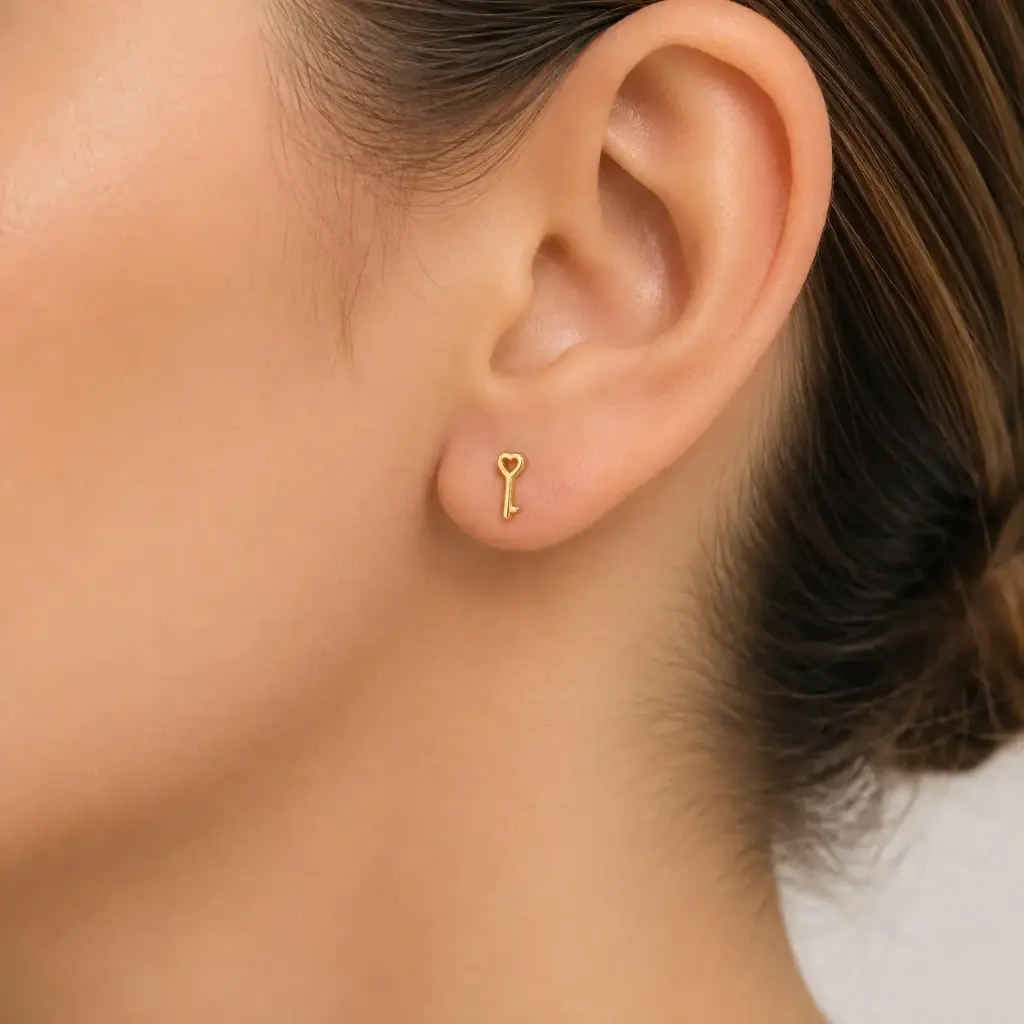 Aretes en rodinado gold topos mini llave