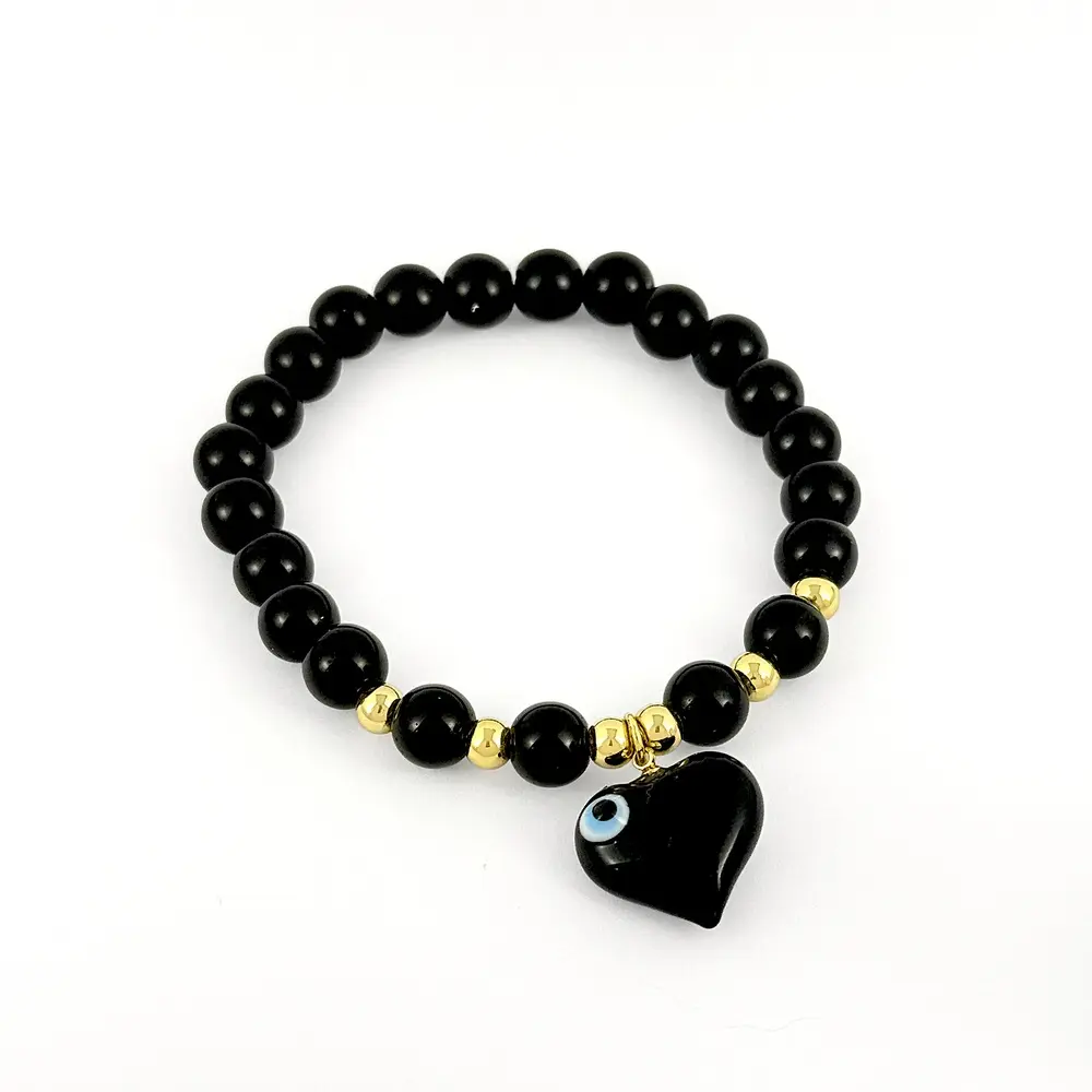 Pulsera en rodinado gold bolas negras dije corazón recina ojito