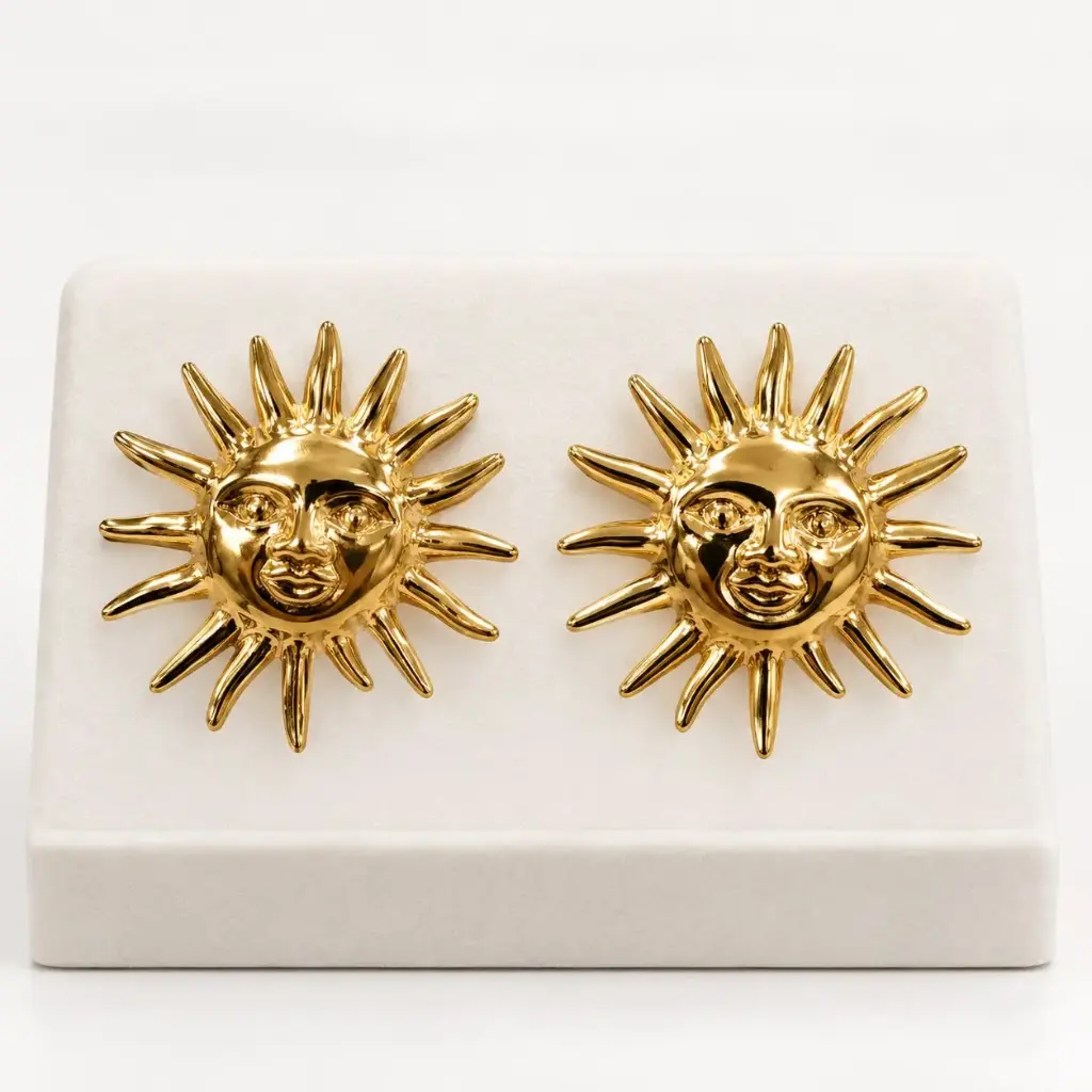 Maxi aretes en acero dorados sol