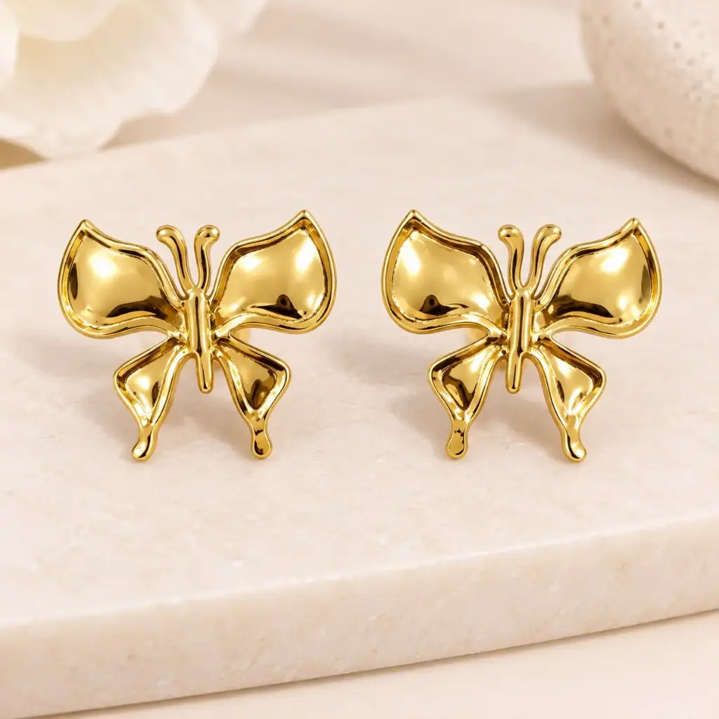 Maxi aretes en acero gold mariposa