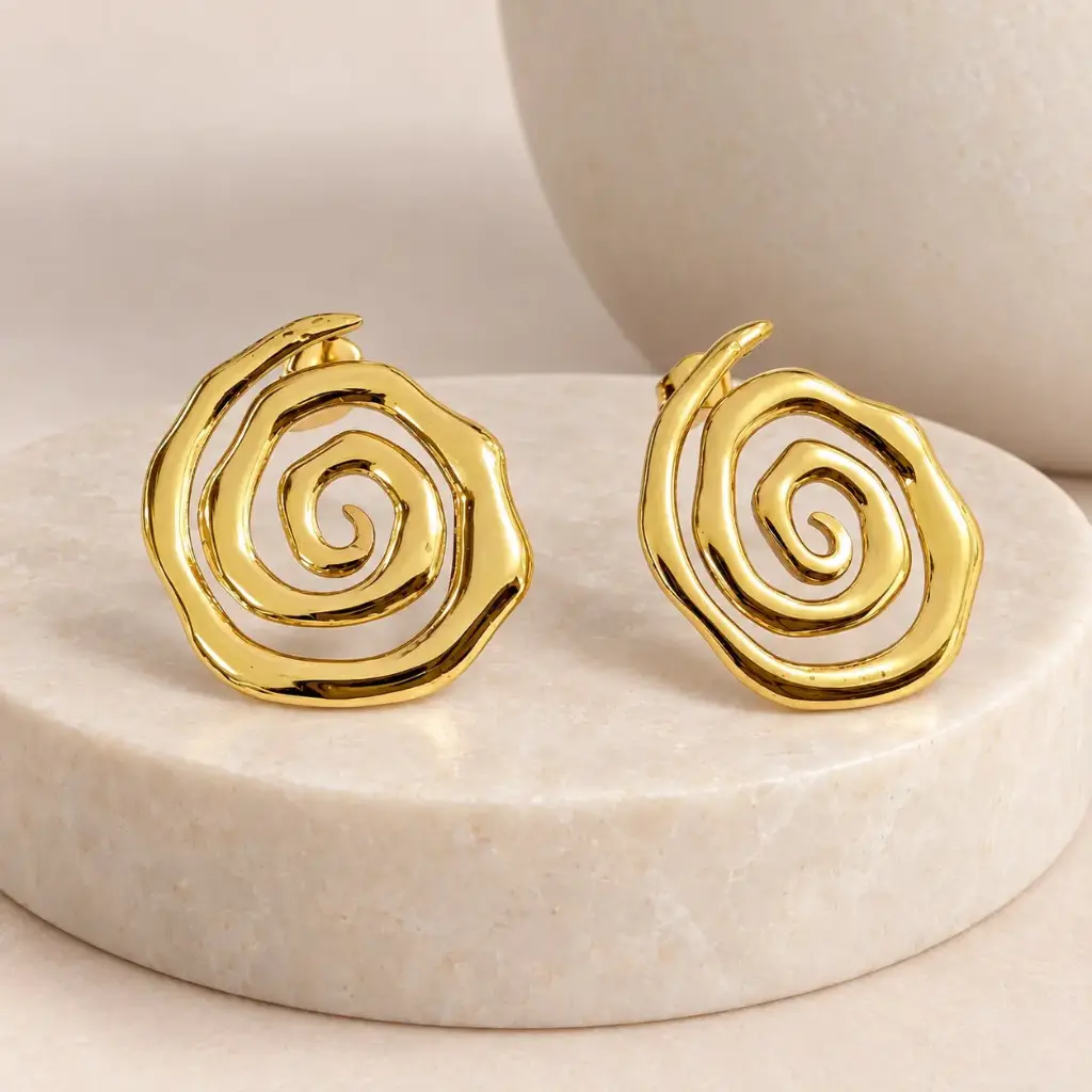 Maxi aretes en acero gold espiral
