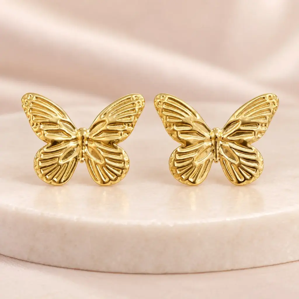 Maxi aretes en acero gold mariposas