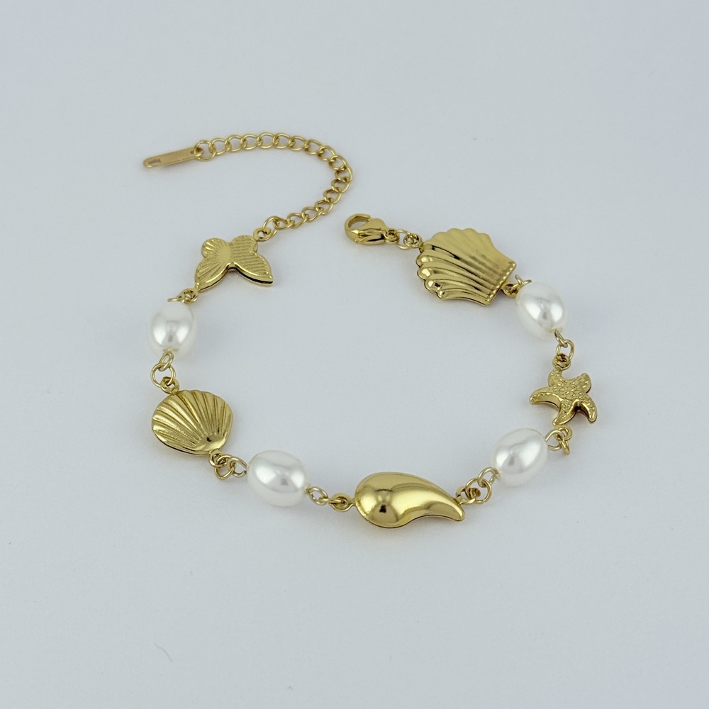 Pulsera en acero gold perlas dijecitos mar