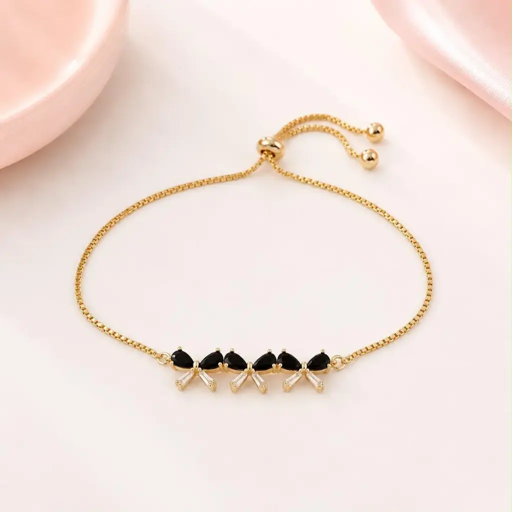 [G-PL-232] Pulsera en Rodinado Gold Champagne ajustable lazo cristales negros