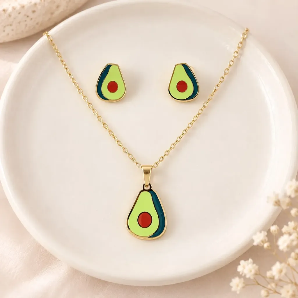 [AC-JU-223] Set esmaltado en acero gold figura aguacate