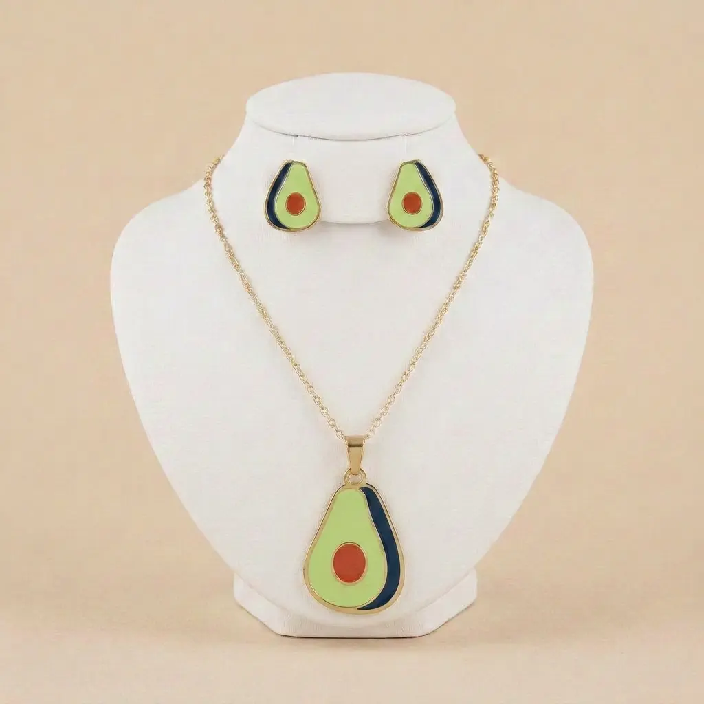 Set esmaltado en acero gold para niñas figura aguacate