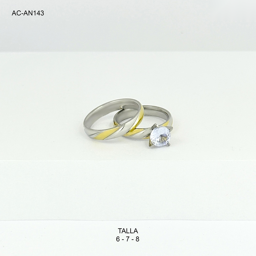 Anillo en acero bicolor pisargolla juego x2