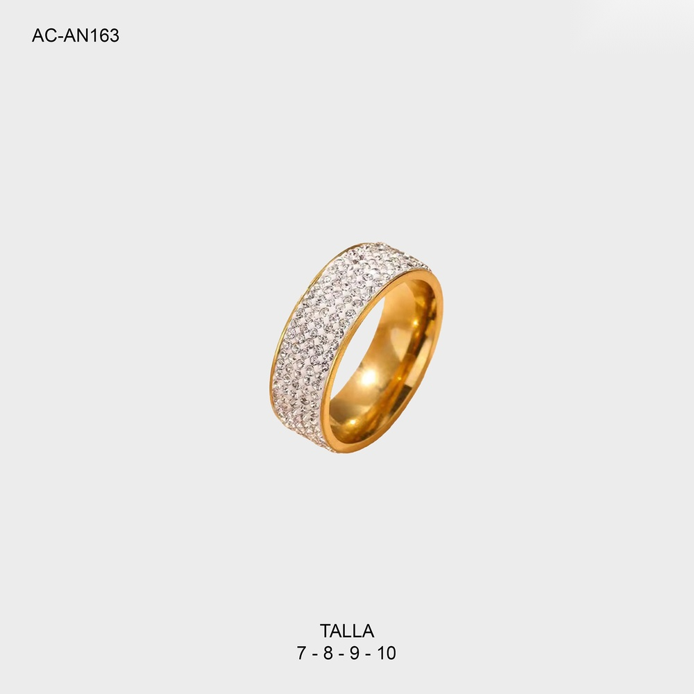 Anillo en acero gold cinco líneas plano circones blanco