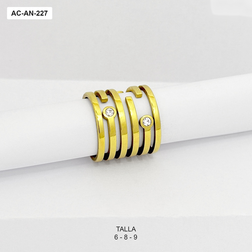 Anillo en acero gold diseño de tiras y circones