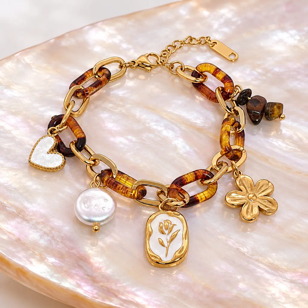 Pulsera en Acero Inoxidable dorada carey dijes charms