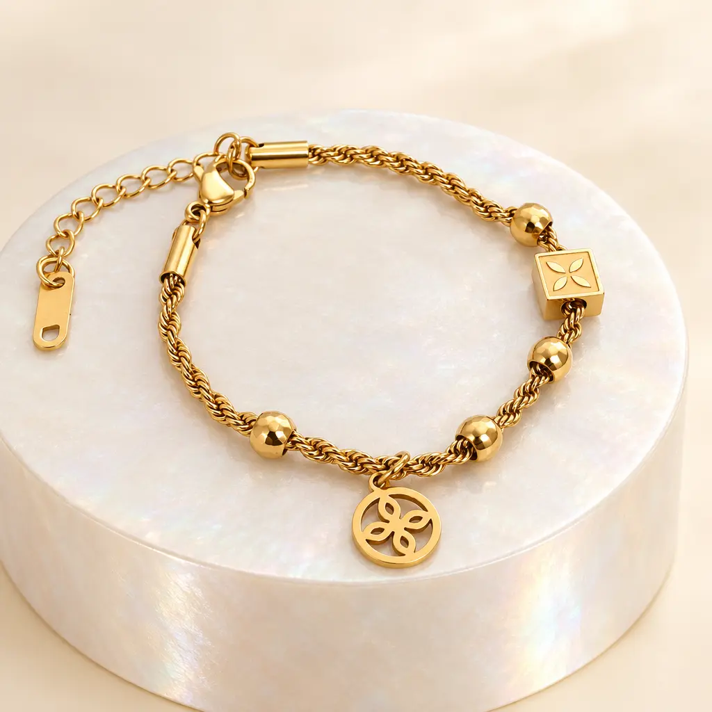 Pulsera en Acero Inoxidable dorada cordón dije van cleef