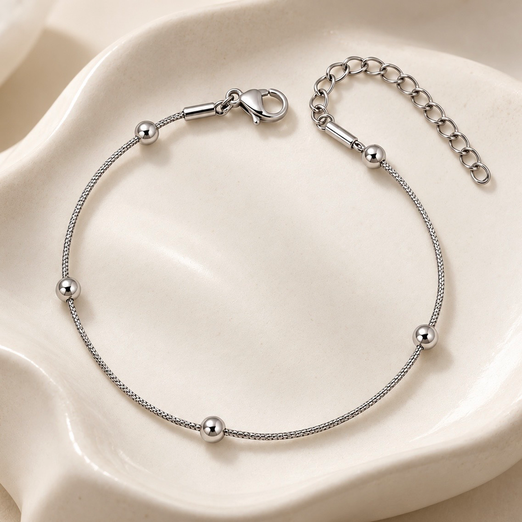 Pulsera en acero inoxidable plateada bolitas