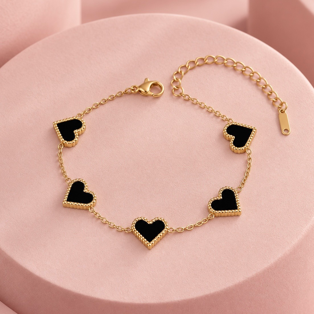 Pulsera en acero inoxidable dorada corazones carey negro