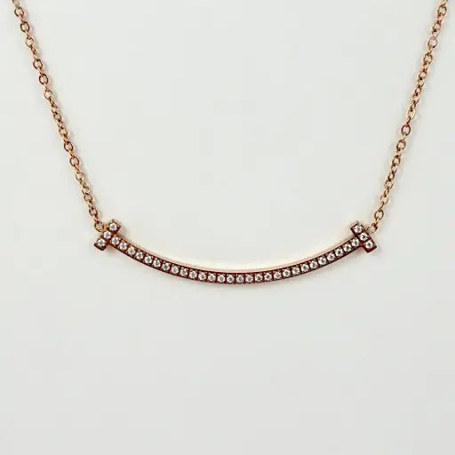 [AC-CDD-156] Collar en acero gold rose dije sonrisa microcircones blancos