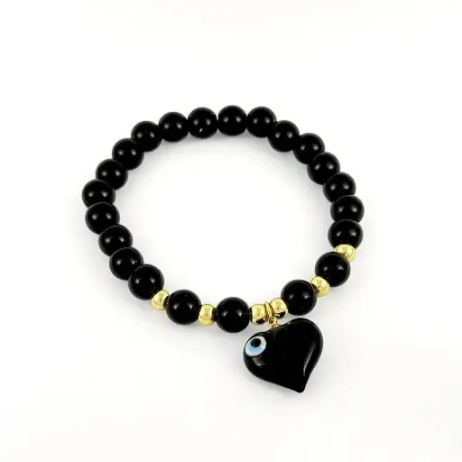 [G-PL-221] Pulsera en rodinado gold bolas negras dije corazón recina ojito