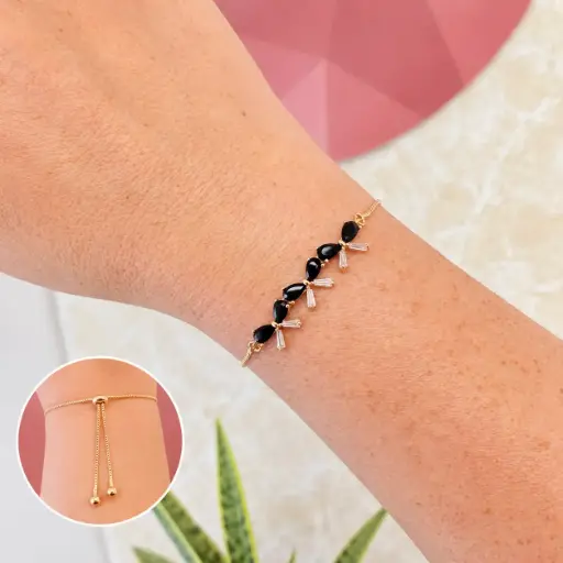 [G-PL-232] Pulsera en Rodinado Gold Champagne ajustable lazo cristales negros