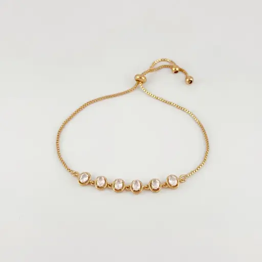 [G-PL-233] Pulsera en Rodinado Gold Champagne ajustable ovalos cristales blancos